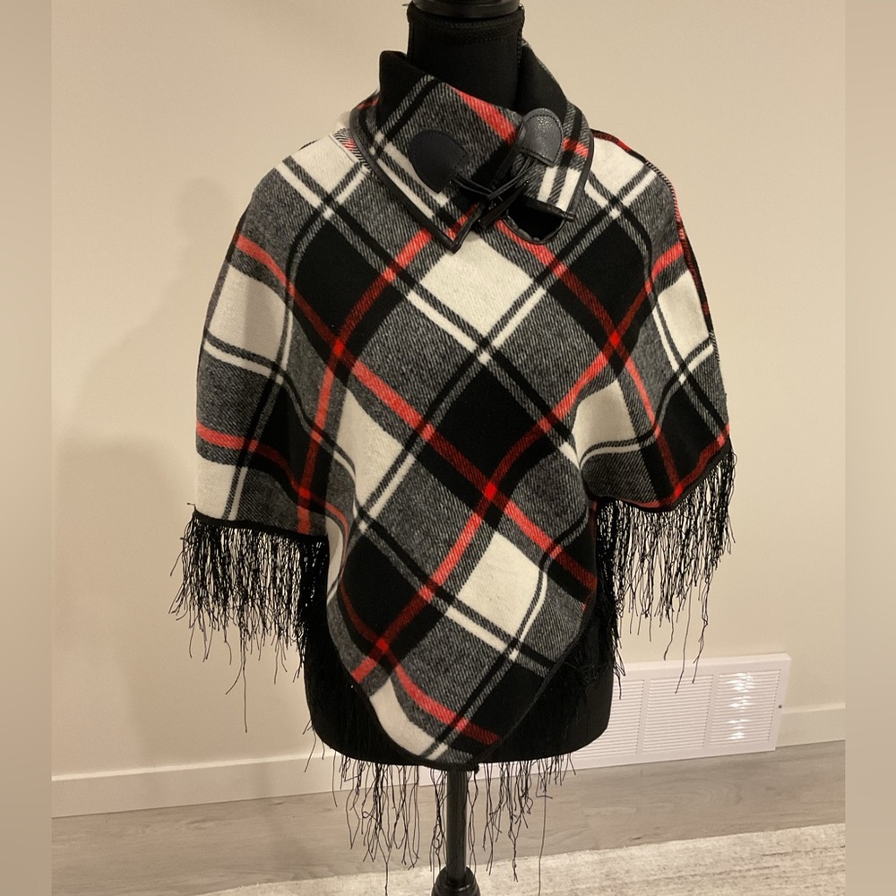 SAY WHAT? Over the head patterned poncho with arm holes and frills.